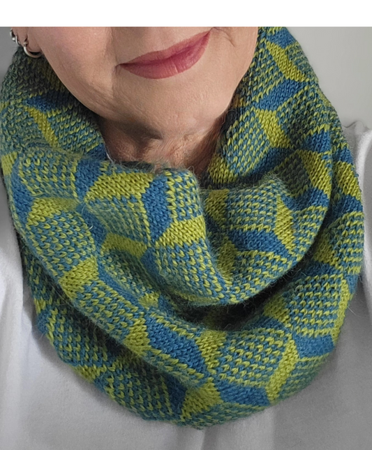 woman wearing blue green cube motif cowl